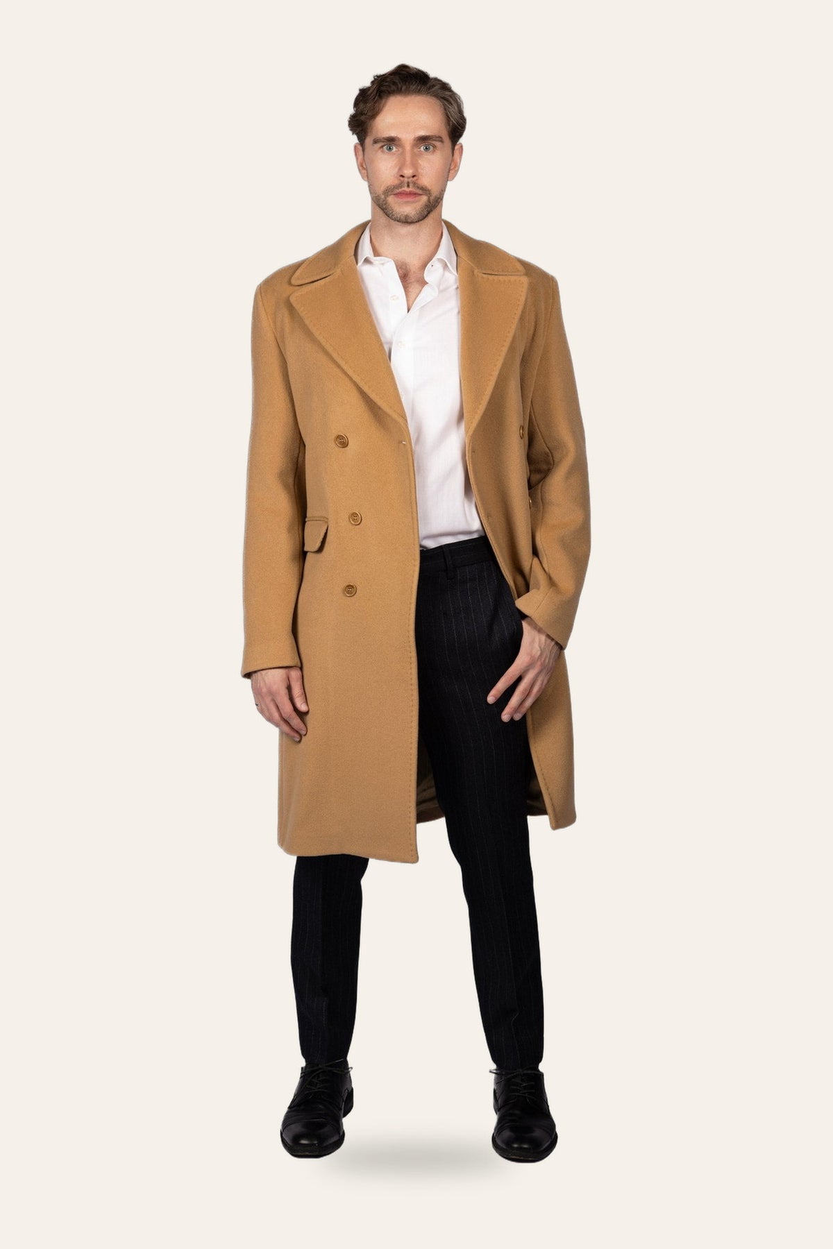 Double-breasted camel coat, front view — DAÉIN