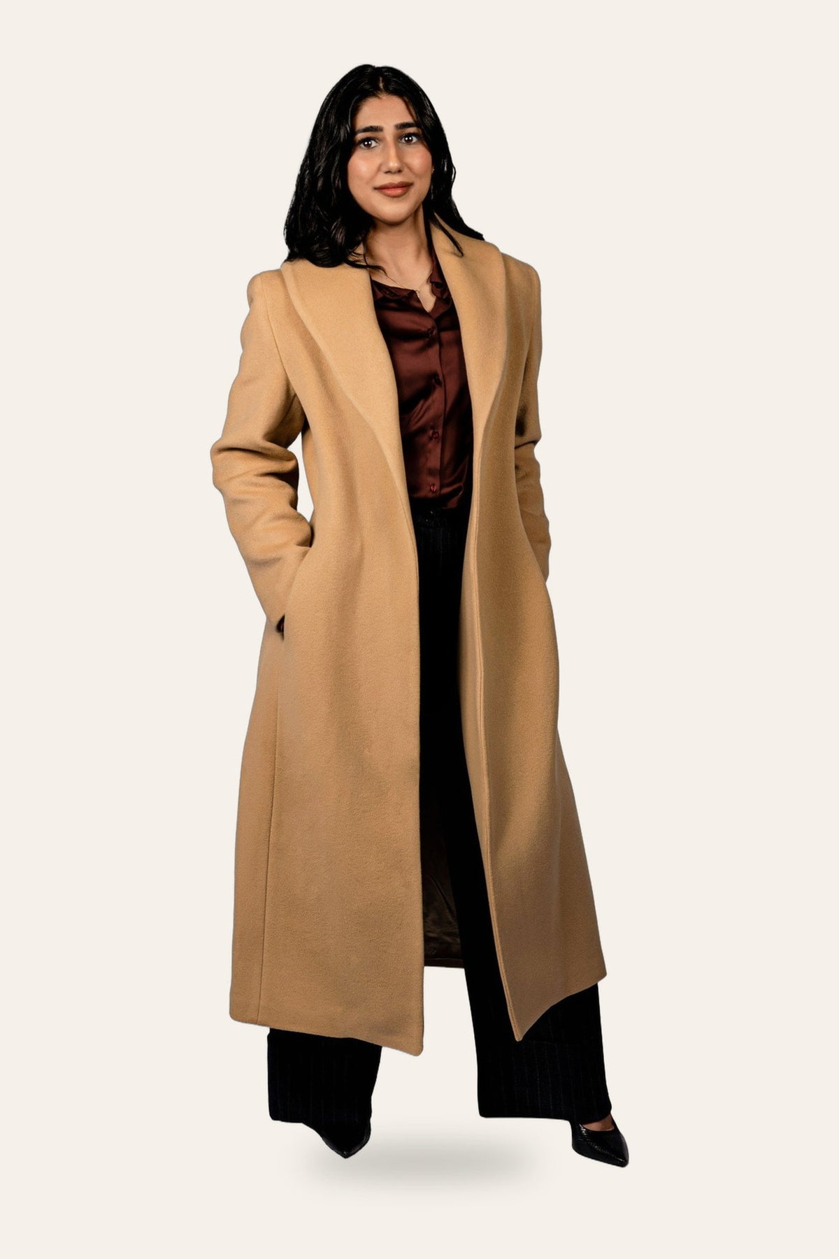 Belted camel coat, front view — DAÉIN